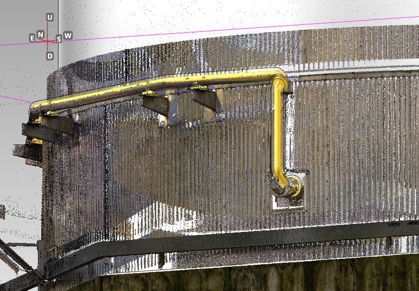 New yellow pipe and supports modelled on the laser-scan point cloud of an existing tank
