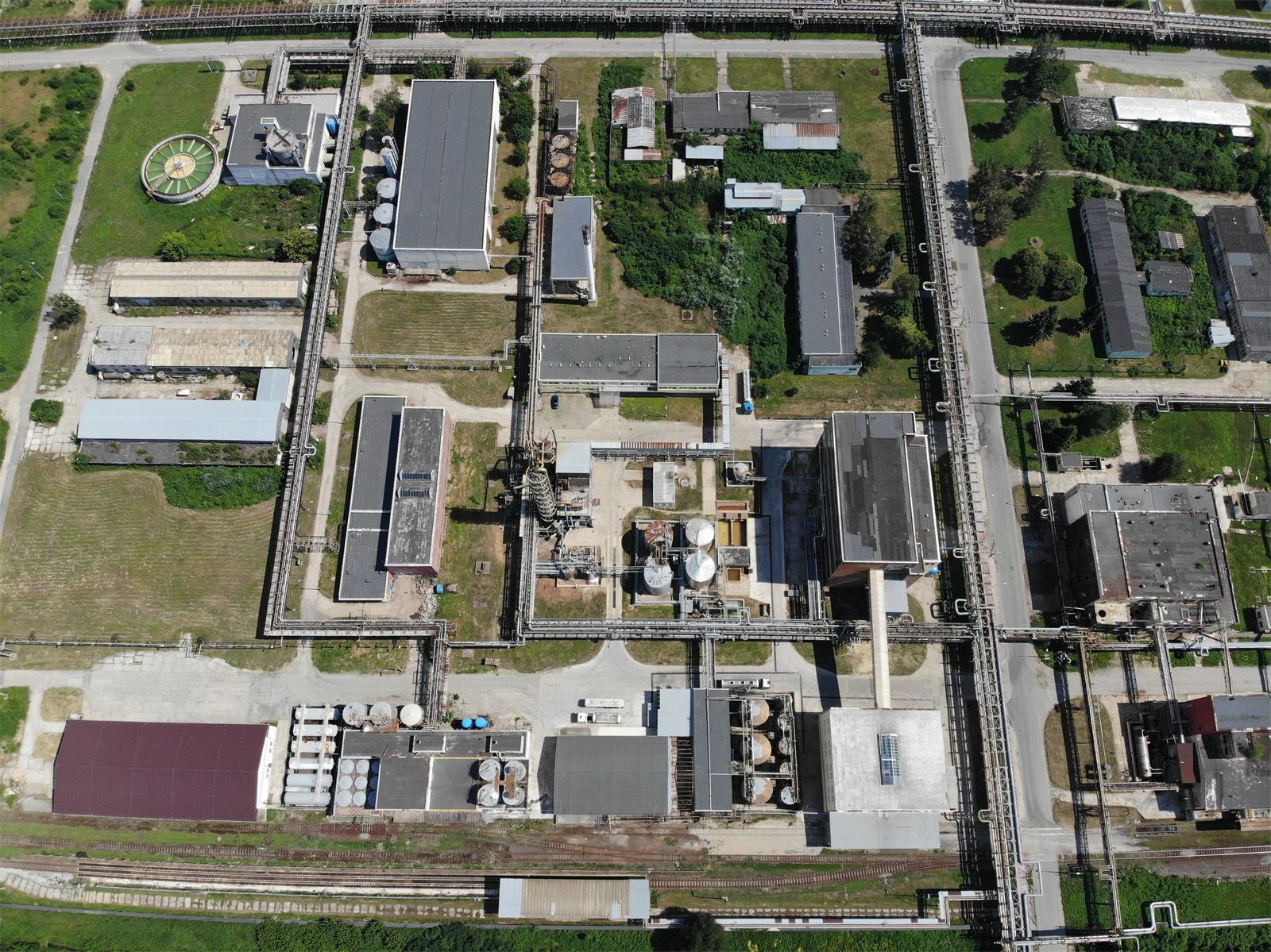 Aerial view of a chemical site with formaldehyde and glue plants, tanks and a rail siding